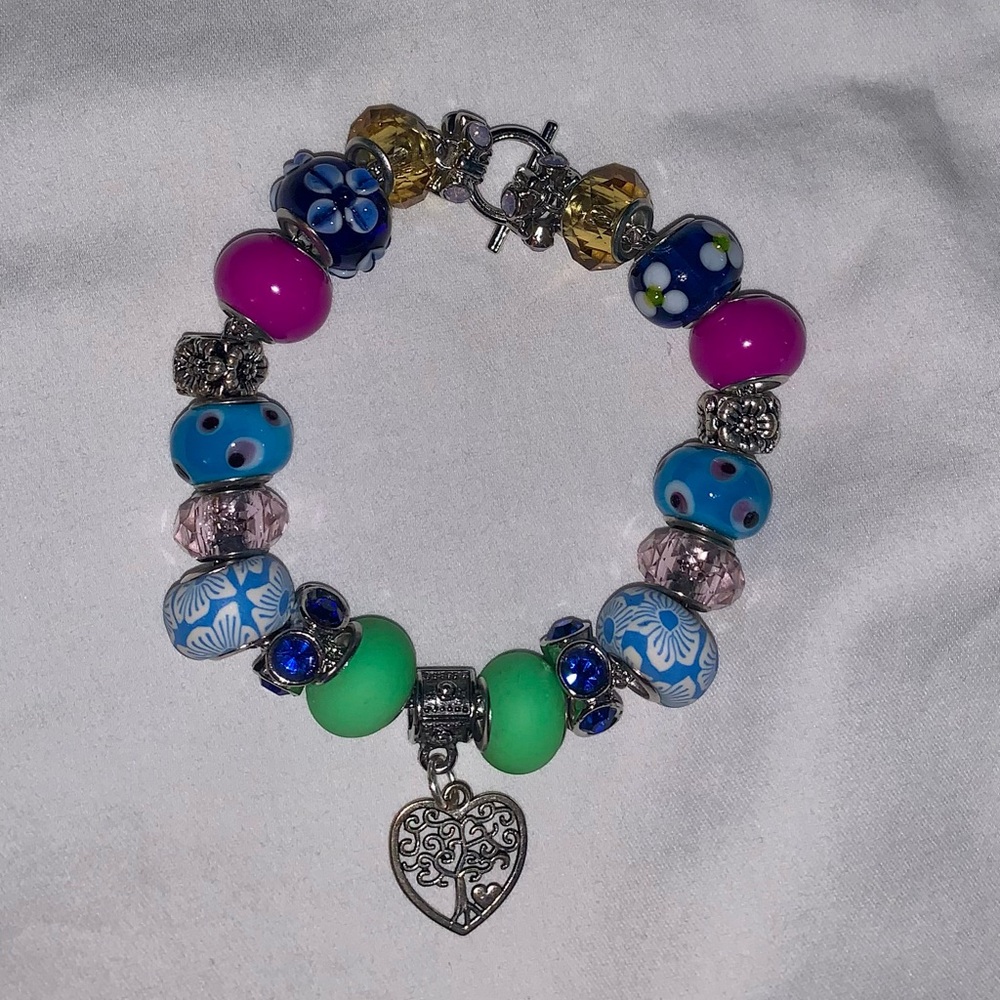 Handmade Bracelet, Springtime Theme. Made of Glass Beads, Charms, Crystal Beads.